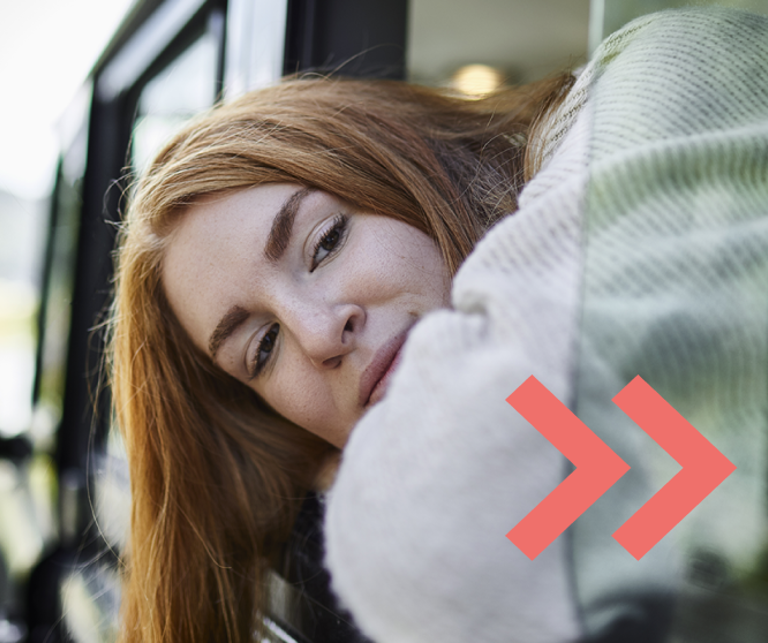 Woman looking out of the window of a car